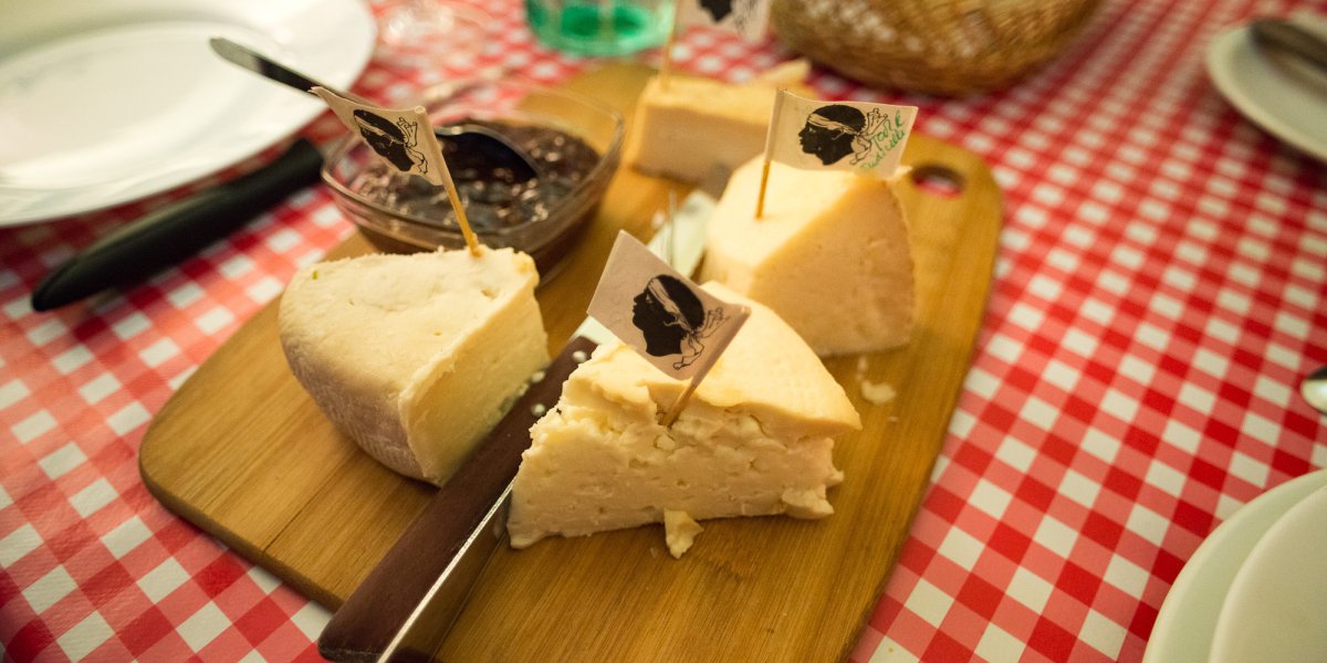 Traditional Corsican goat and sheep's milk cheese labeled with withe the Moor's head Corsican flag
