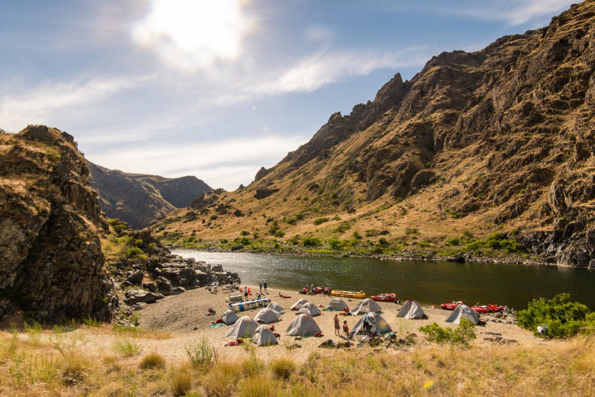 Setting up camp on a sandy beach along the Snake River through Hells Canyon in Idaho