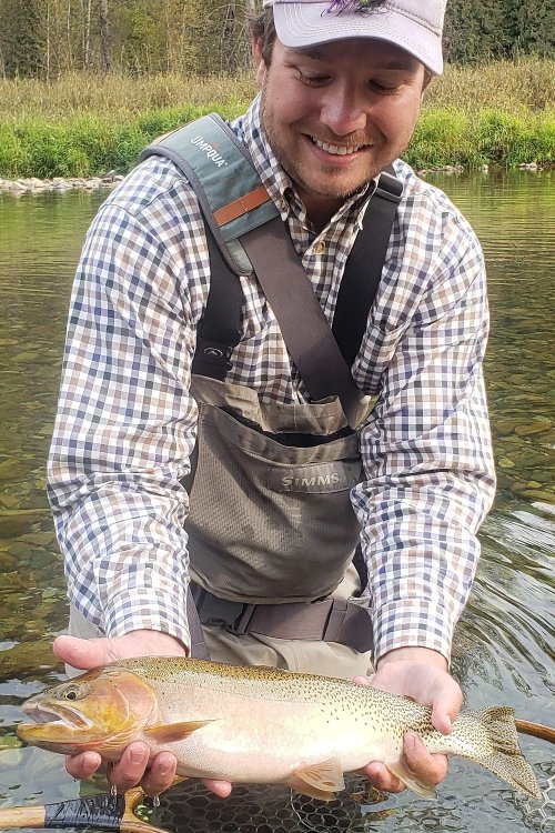 Idaho fishing guide holding cutthroat trout