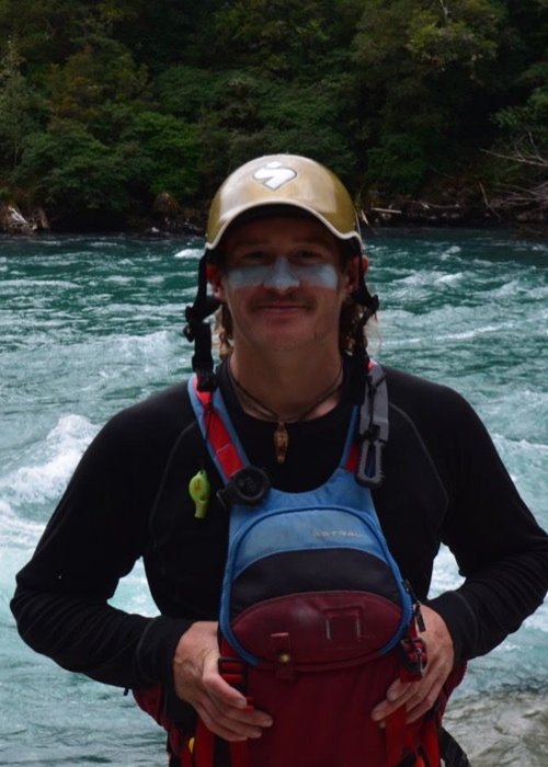 male river guide with hat and blue pfd
