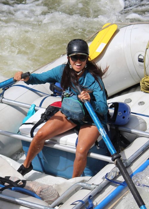 Idaho river guide rowing a raft