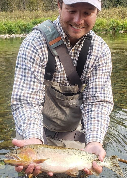 Idaho fishing guide holding cutthroat trout
