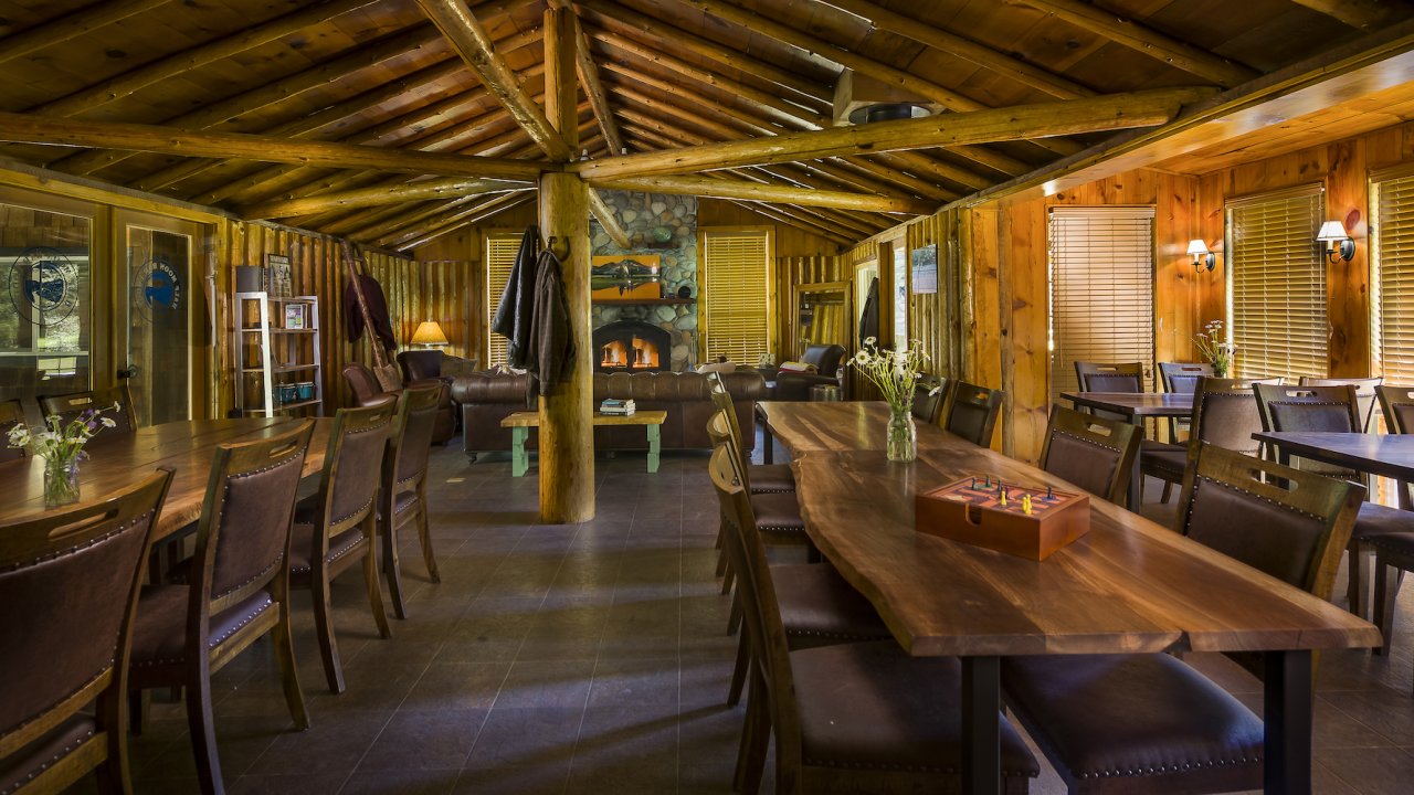 Long empty tables in the communal dining room of Half Moon Bar loodge