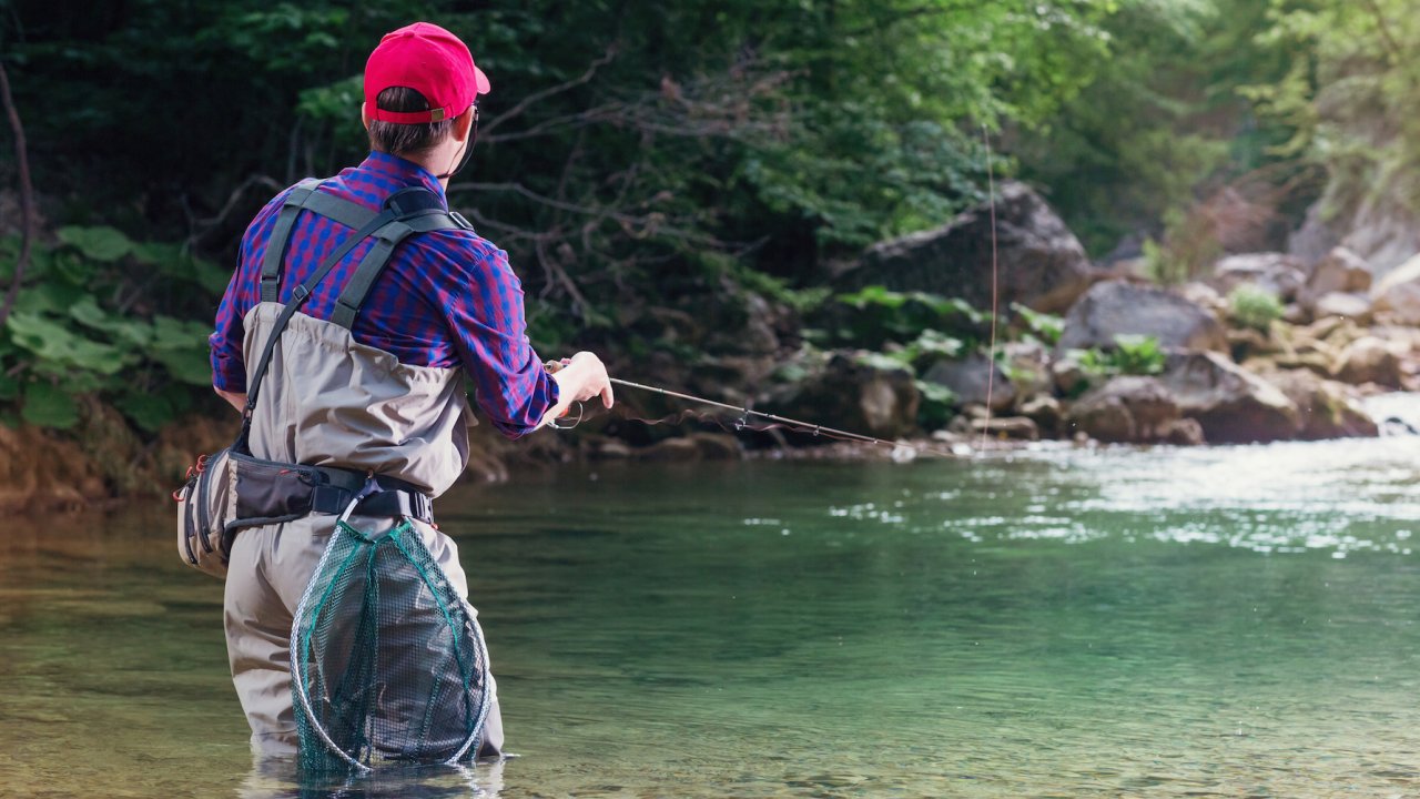 Man in gaiters fishing in North Idaho