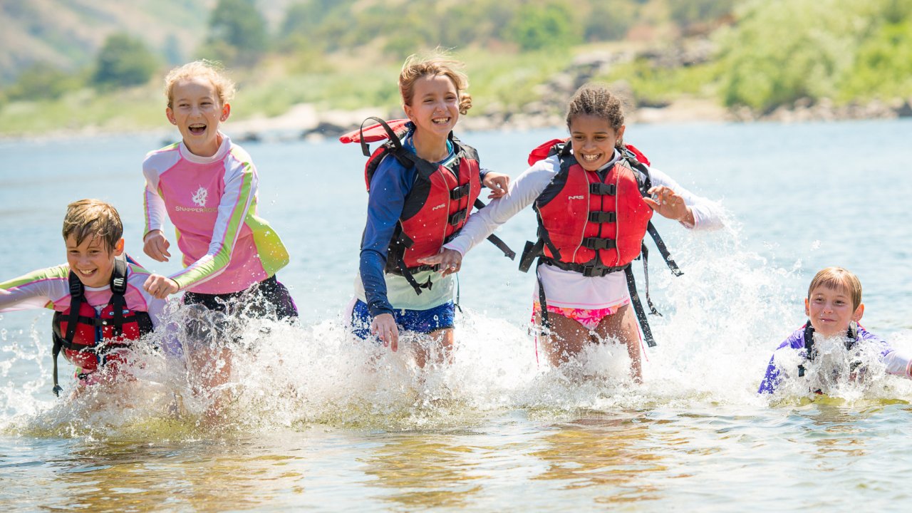 kids playing on the salmon river in idaho