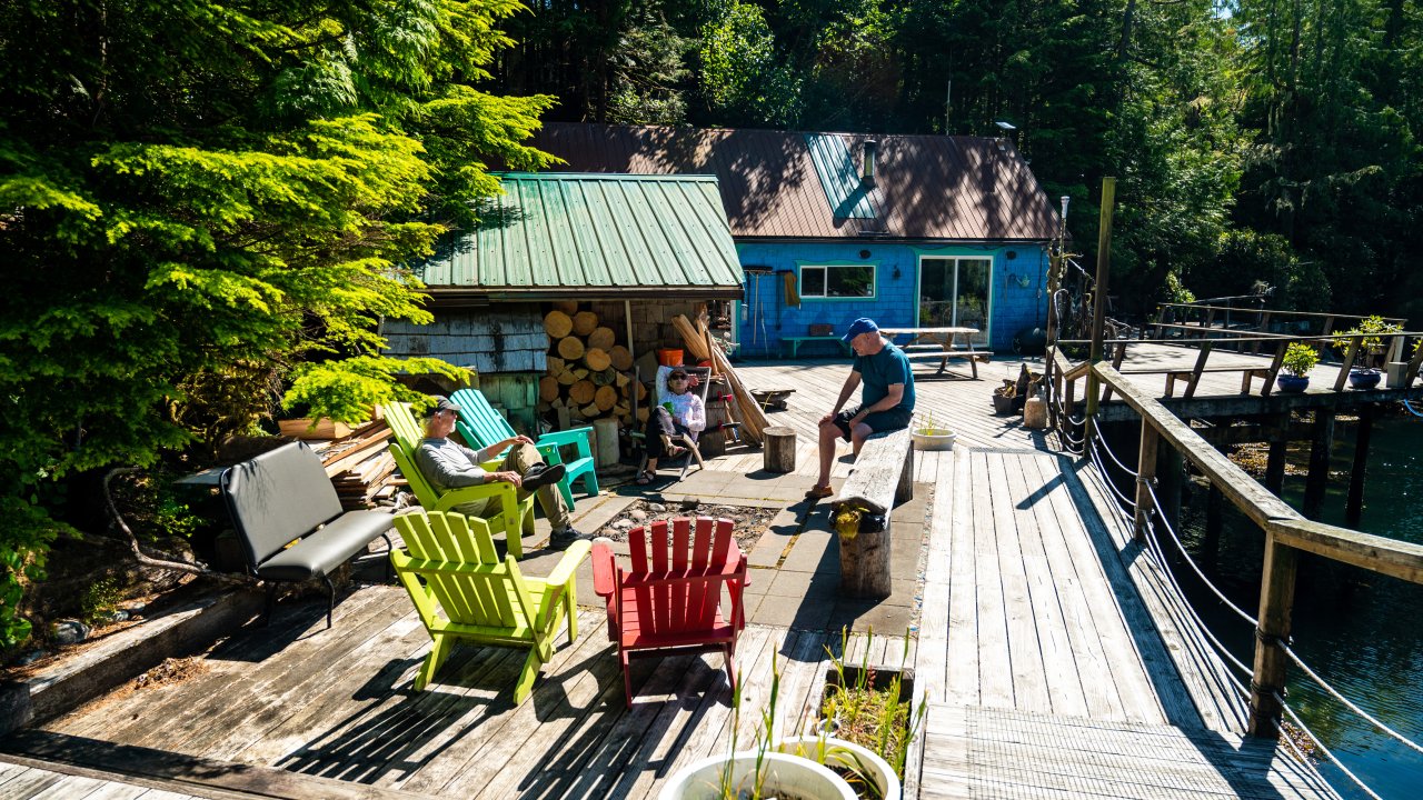 Guests enjoying the deck along the water at God's Pocket Resort