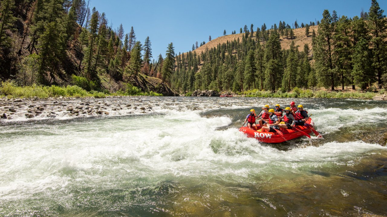 People on a whitewater raft going through a rapid on the Middle Fork Salmon River