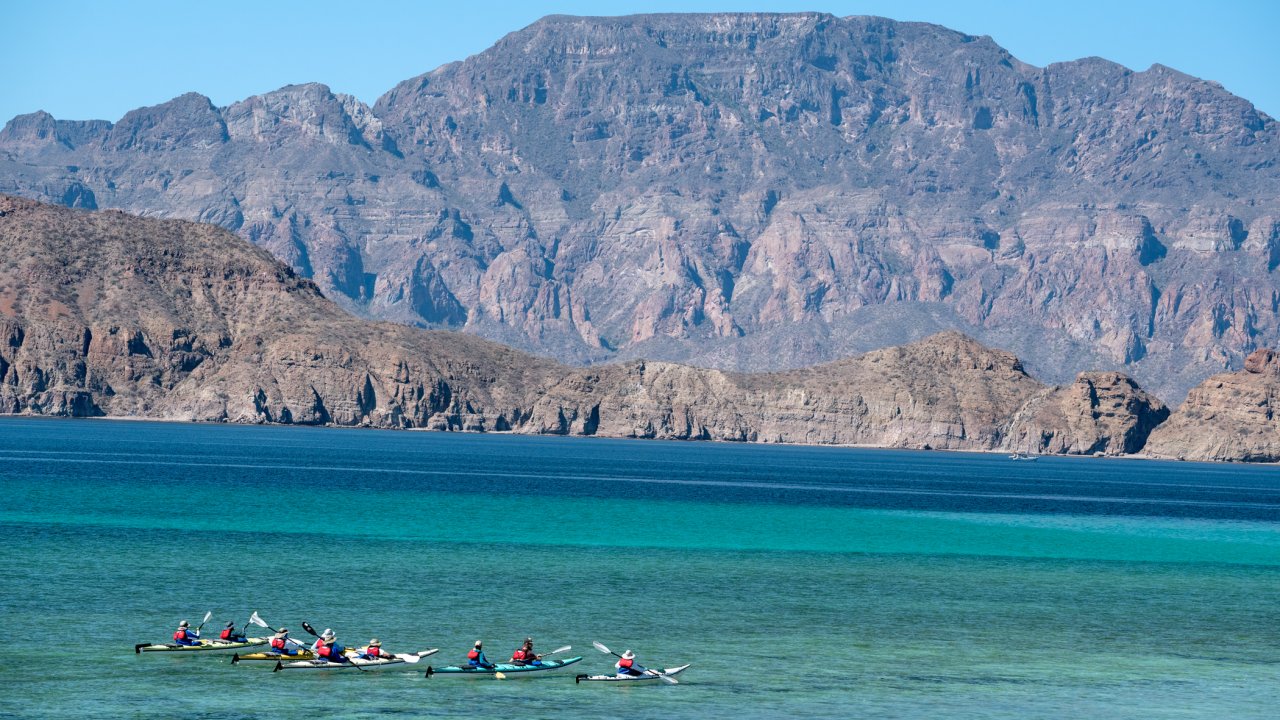 Sea Kayakers amongst the desert landscape of Loreto Bay National Park