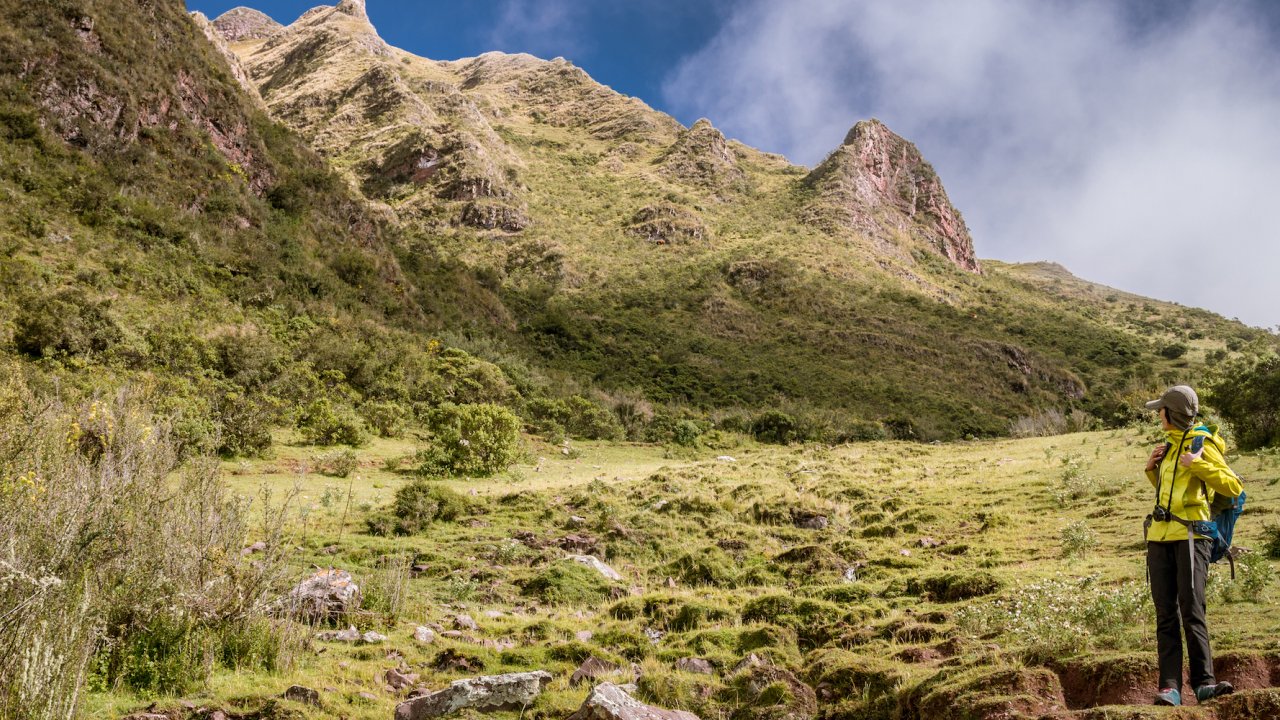 A woman hiking to Machu Picchu on a sustainable guided tour