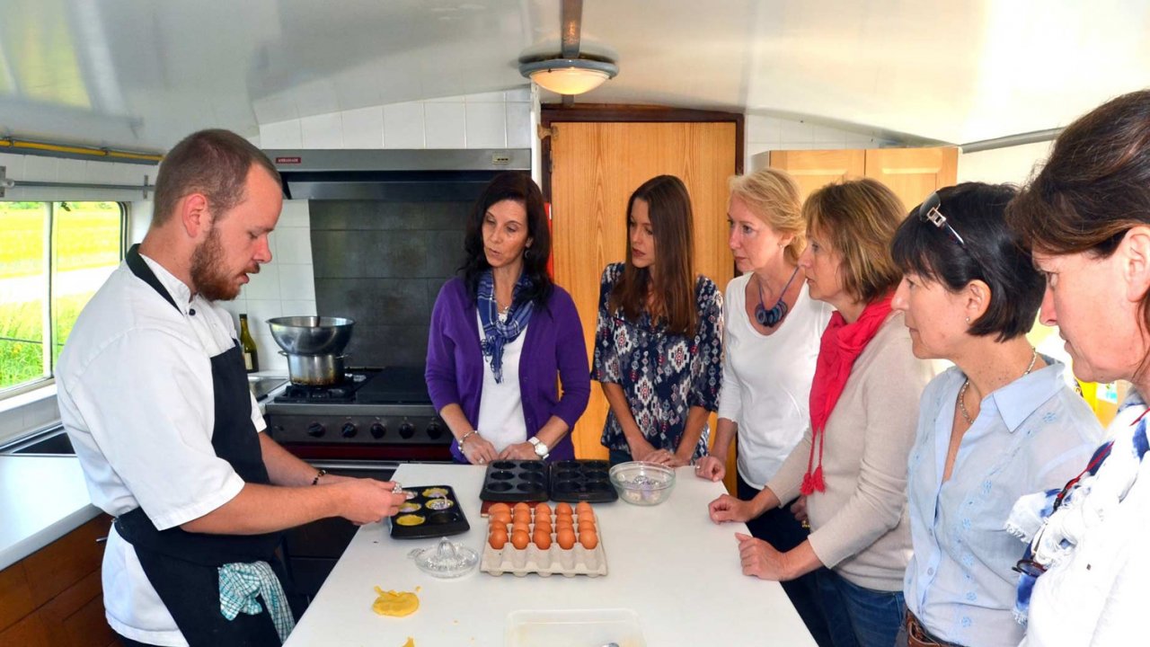 chef giving cooking demo to people