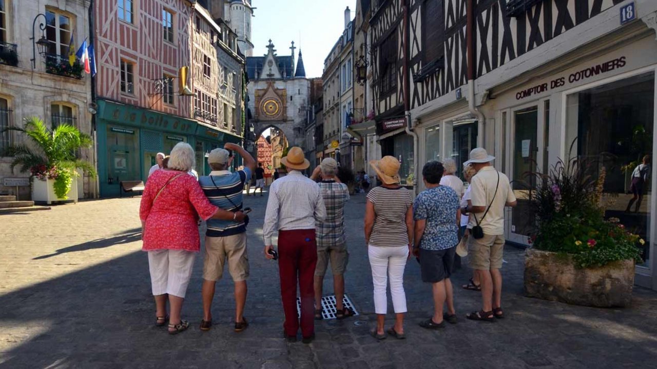 people on walking tour of french city