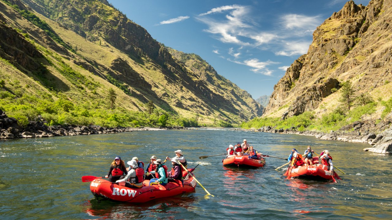 three red rafts on the snake river in idaho