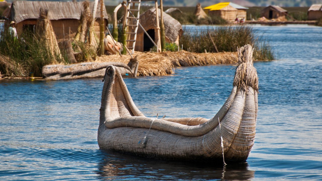 Canoes in Lake Titicaca, Peru