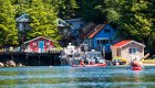 Sea kayakers paddling towards God's Pocket Resort in British Columbia