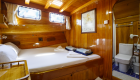 Queen bed room configuration aboard a small cruise yacht in Turkey