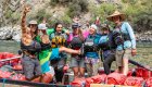 rafting guides standing in front of cargo raft