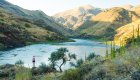A girl overlooking the Salmon River canyon at sunset on a hike 