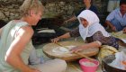 A Turkish woman explaining to another woman tourist how to make Turkish food