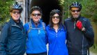 Cyclists posing at a tunnel entrance on the Banks-Vernonia Trail during a guided Oregon cycling tour