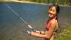 girl fishing along the clearwater river