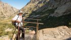 A traveler pauses at a mountain viewpoint during a guided Corsica tour, taking in the rugged alpine landscapes of the island’s interior.