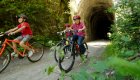 kids riding bikes on hiawatha trail in Idaho