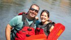 Couple smiling while rafting the Deschutes river