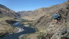 Group of hikers overlooking the Snake River through Hells Canyon from hike viewpoint