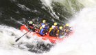 raft going through a large whitewater rapid