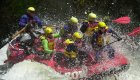 whitewater raft with people in splashy water