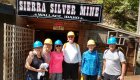 group of people standing outside silver mine