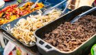 Campfire meal with grilled steak and veggies during a Salmon River main fork adventure.