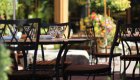 Elegant outdoor dining setup surrounded by flowers, reflecting the relaxed culinary experiences on the Oregon bike tour