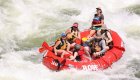 red raft navigating white rapids on the clark fork river 