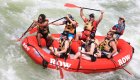 people in red raft on clark fork river
