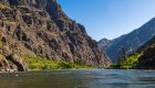 Scenic view of the Salmon River winding through Idaho’s dramatic canyons, an inspiring destination for whitewater rafting and wellness travel retreats.