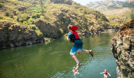 boy cliff jumping on the salmon river